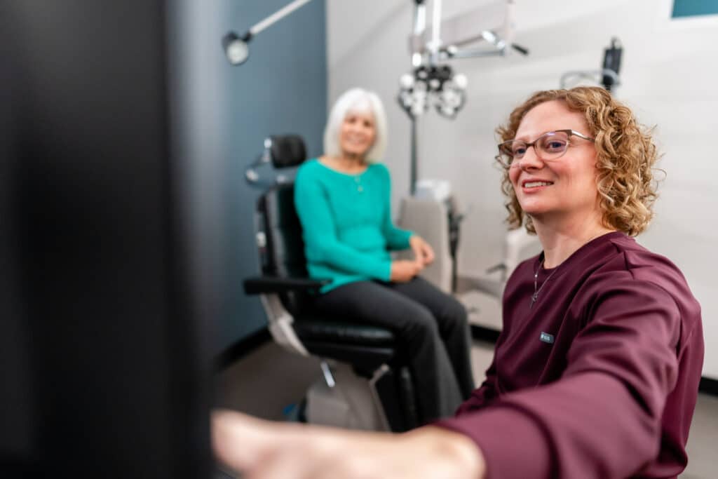 North Idaho Eye Institute eye doctor working with a patient in Hayden